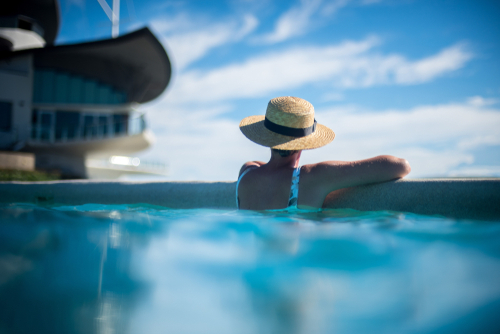 Woman With Straw Hat In Pool