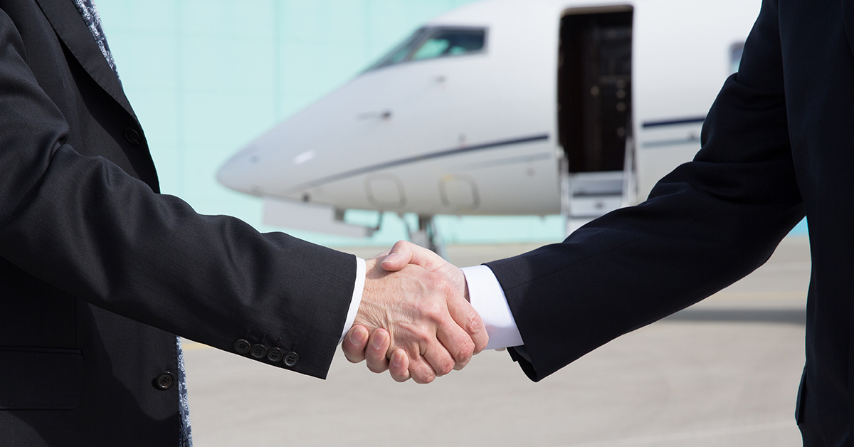 charter flight shaking hands